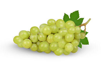 Close-up of grapes over white background