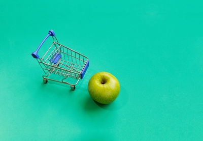 Fruits in blue over green background