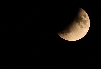 Low angle view of moon against sky at night