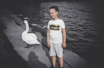 Full length of boy standing in water