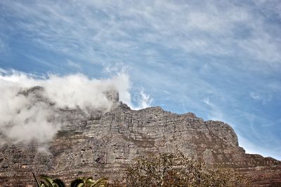 Scenic view of clouds over table mountain against sky