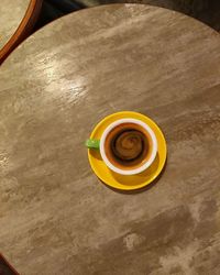 High angle view of coffee cup on table