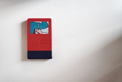 Close-up of telephone booth against white background