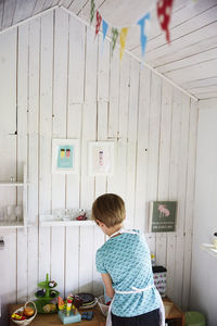 Boy playing with kitchen set