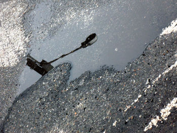 High angle view of puddle on road