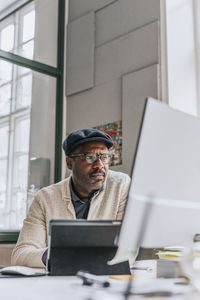 Concentrated businessman working on computer at office