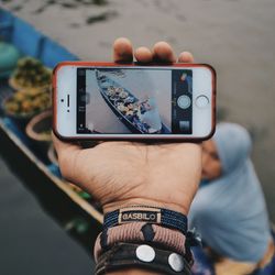 Close-up of man using mobile phone