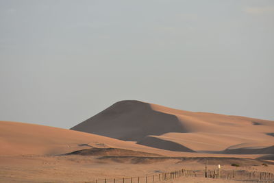 Scenic view of desert against clear sky