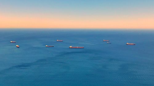 Scenic view of sea against clear sky during sunset