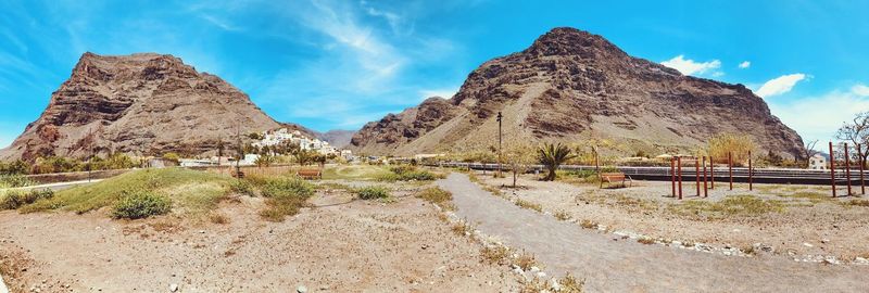 Panoramic view of mountain road against sky