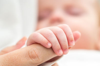 Close-up of mother holding baby