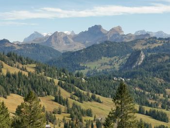 Scenic view of landscape and mountains against sky