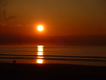 Scenic view of sea at sunset