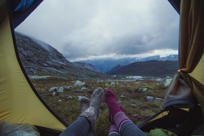 Close up ladies lying in tent in mountain valley concept photo