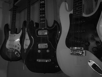 Close-up of guitars for sale at store