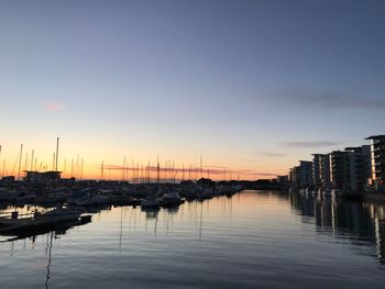 Sailboats in marina at sunset