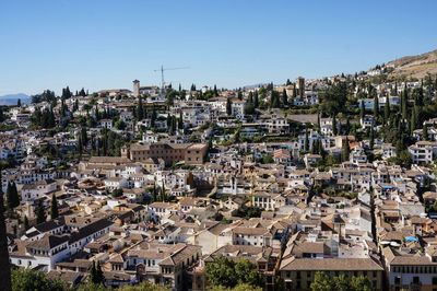 Aerial view of houses in granada town against clear sky