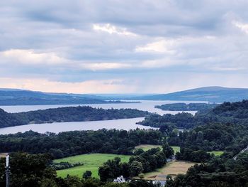 Scenic view of landscape and sea against sky