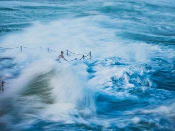 Man surfing in sea