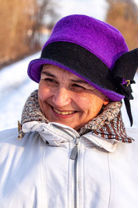 Portrait of smiling man in snow