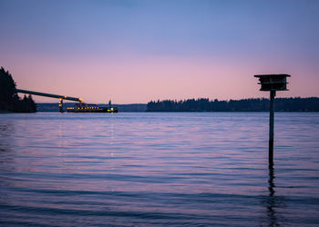 Scenic view of calm sea at sunset