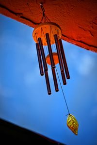 Low angle view of light bulbs hanging from ceiling