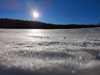 Scenic view of frozen lake against sky during winter