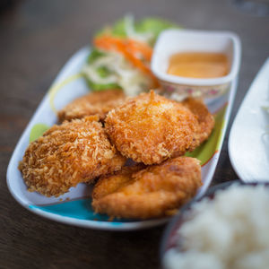 Close-up of fried food in tray on table