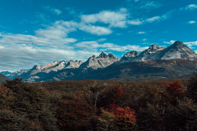 Scenic view of mountains against cloudy sky