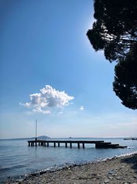 Pier over sea against sky