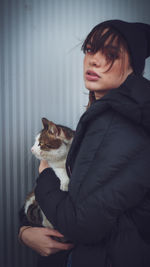 Young woman with cat