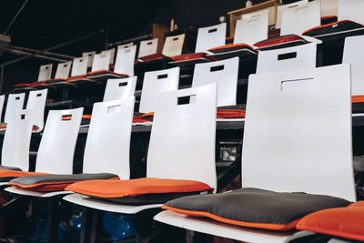 Close-up of chairs in row