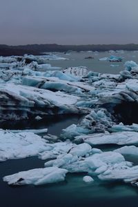 Scenic view of frozen sea against sky