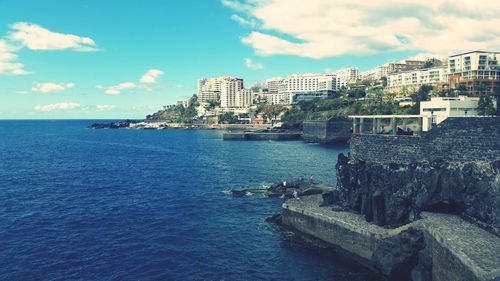 Scenic view of sea against cloudy sky