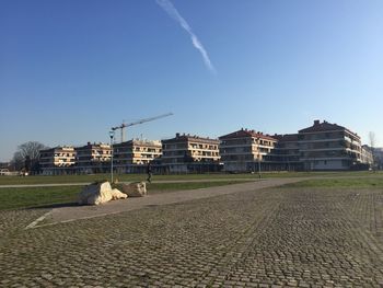 Buildings against blue sky and clouds