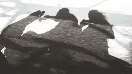 High angle view of people walking on floor