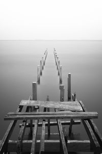 Pier over sea against sky