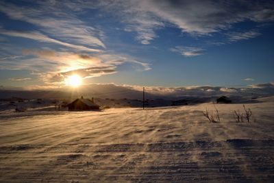 Scenic view of landscape against sky during sunset