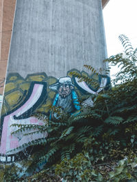 Low angle view of statue against building