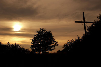 Low angle view of silhouette trees against sky during sunset