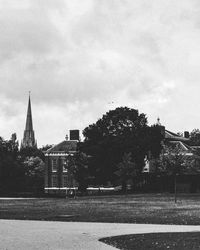 Buildings against cloudy sky