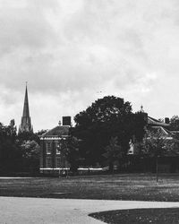 Buildings against cloudy sky