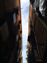 Low angle view of buildings in city against sky