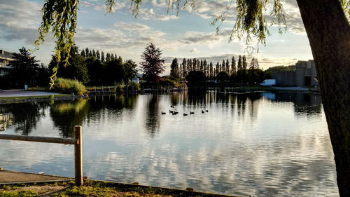 Scenic view of lake against cloudy sky