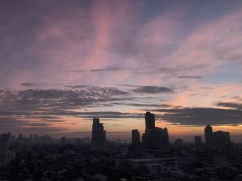 Cityscape against sky during sunset