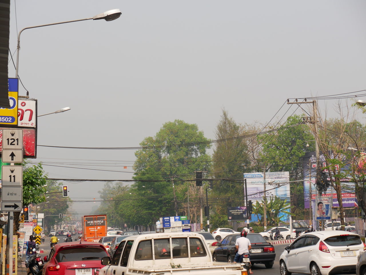 TRAFFIC ON ROAD AGAINST SKY