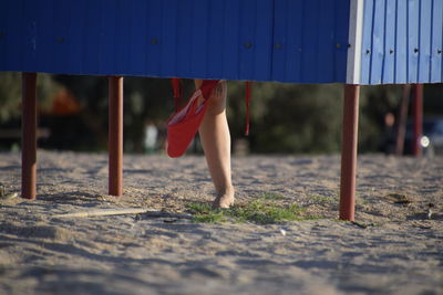 Low section of woman walking on floor