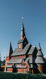 Low angle view of temple building against clear blue sky