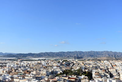 Aerial view of townscape against sky