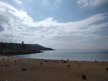 High angle view of people at beach against sky